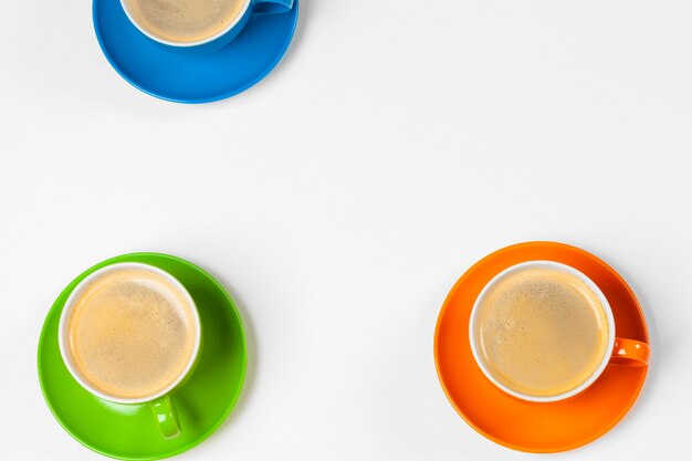 Coffee time. Bright colored composition of coffee cups