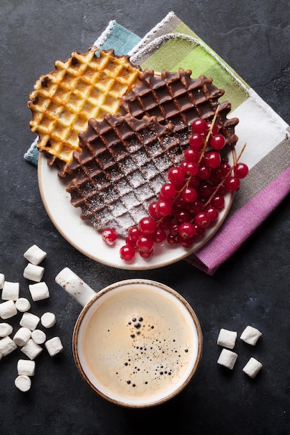 Coffee and waffles with berries