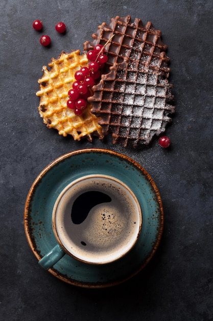 Coffee and waffles with berries