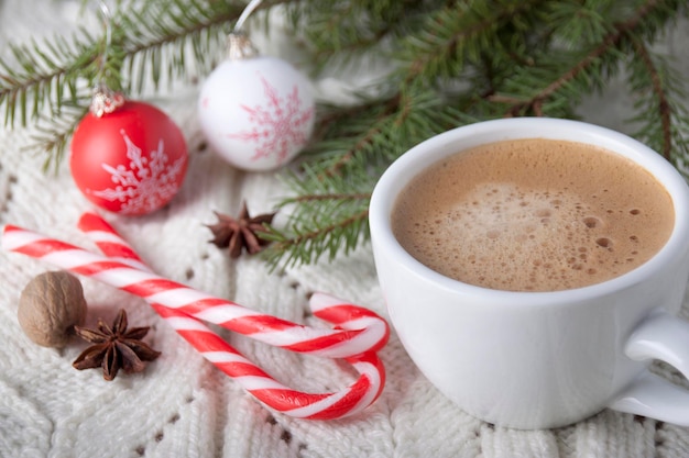 Coffee in a white cup on a white knitted tablecloth