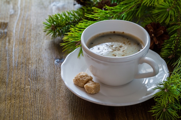 Coffee in white cup with christmas tree