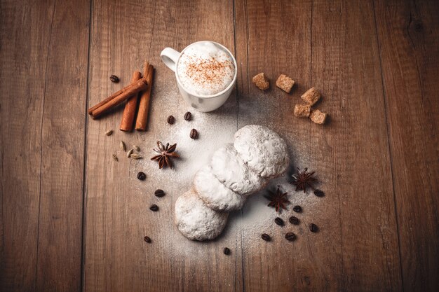 Coffee with biscuits and cinnamon