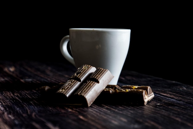 Coffee with chocolate black background