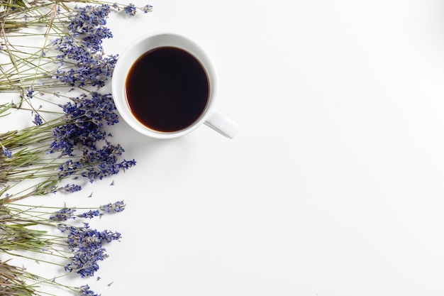 Coffee with flowers composition on the table