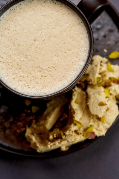 Coffee with halva on a gray background