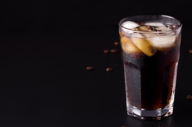 Coffee with ice on a black background