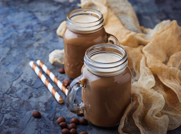 Coffee with milk in jar. Selective focus