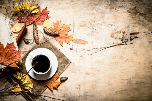 Coffee with an old books and leaves