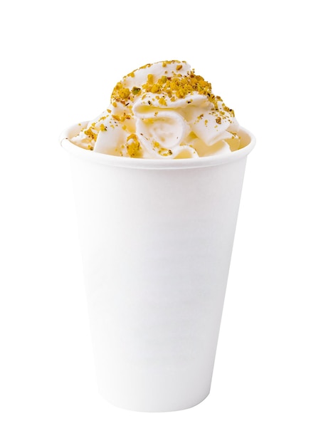 Coffee with pistachios and cream in a paper cup