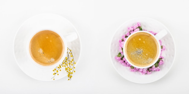 Coffee with the same cups of coffee with different colors of yellow and pink. Top view, flat lay