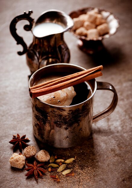 Coffee with spices in a vintage mug