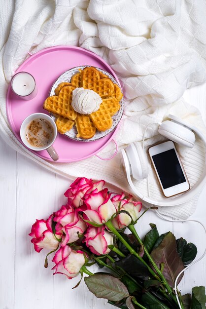 Coffee with waffles and roses. Valentine's Day or 8 march 