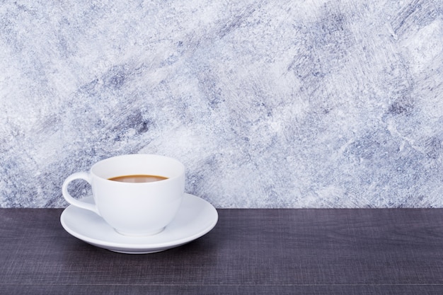 coffee on wood table and wall background