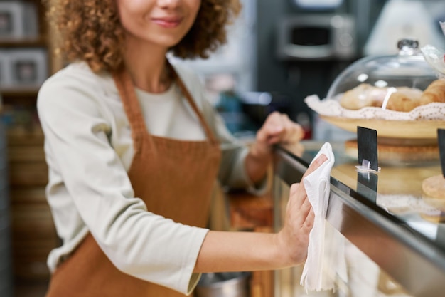 coffeeshop barista cleaning surfaces