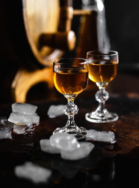 Cognac and glass on an old wooden rustic table