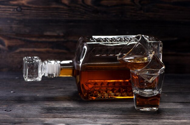 Photo cognac in old vintage bottle and glasses