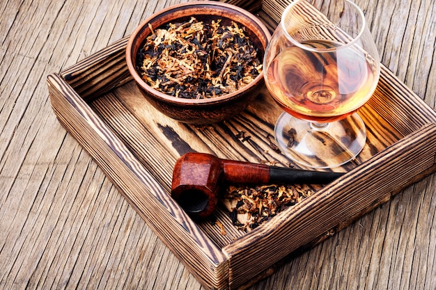 Cognac and pipe with tobacco