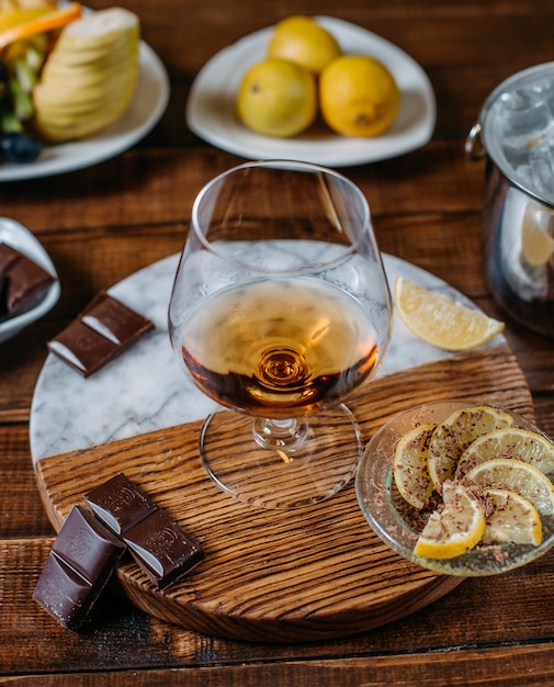 cognac on wooden plate