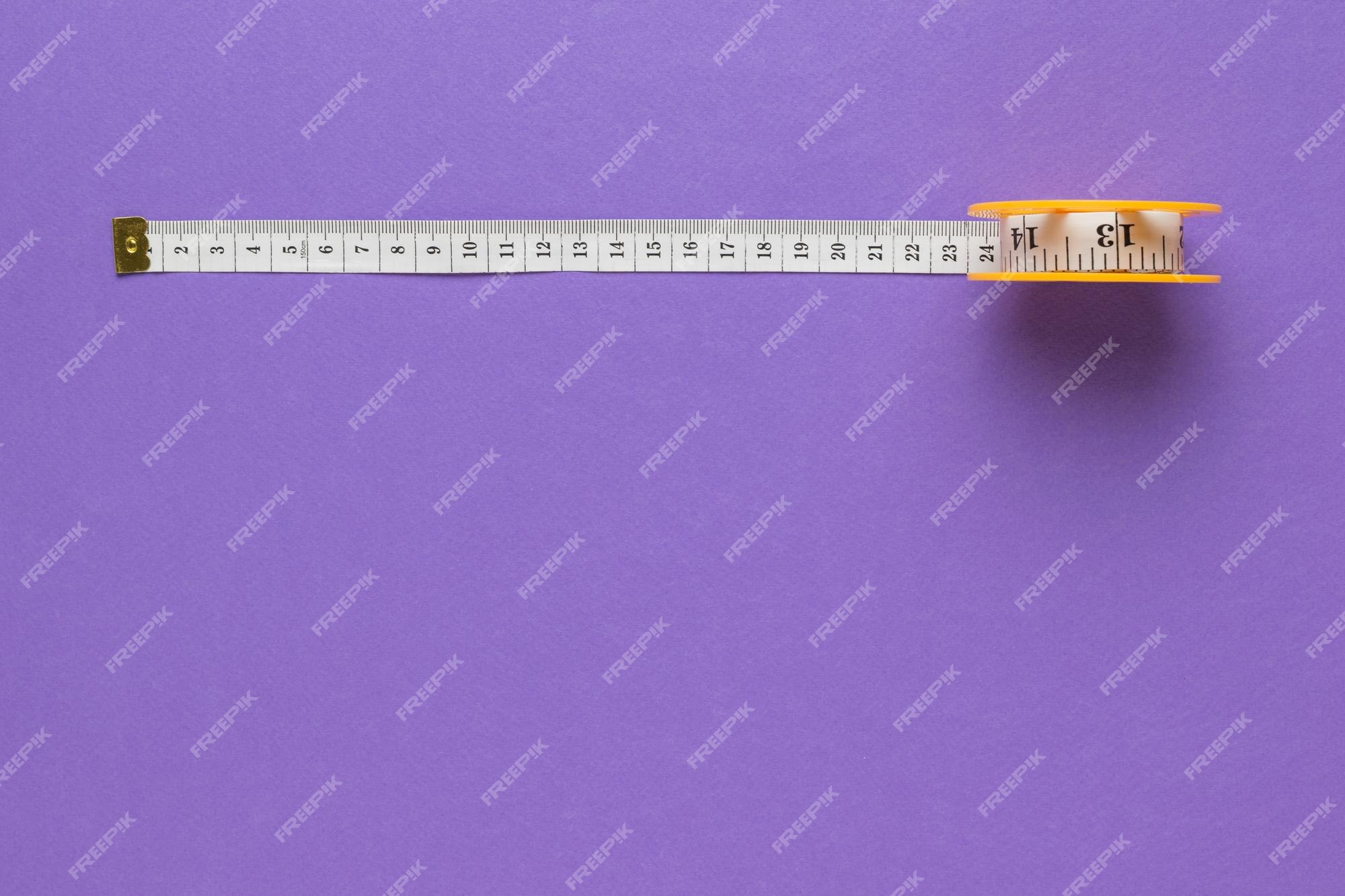 https://img.freepik.com/premium-photo/coil-with-measuring-tape-purple-background-device-measuring-body-parameters-flat-lay-color-trend-place-text_94064-9686.jpg?w=2000