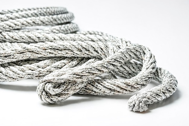 Coiled White Rope on a Plain Background