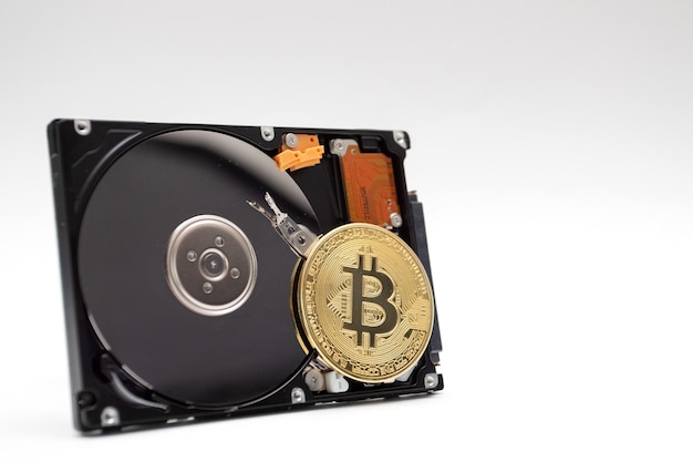 Coin of bitcoin with HDD. Mining Cryptocurrency coin on HDD.