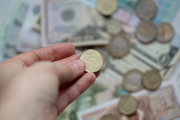 Coin in hand close up