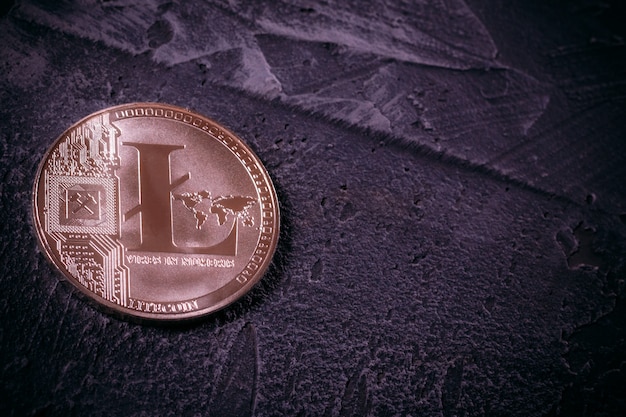 Coin Litcoin LTC on concrete with copy space