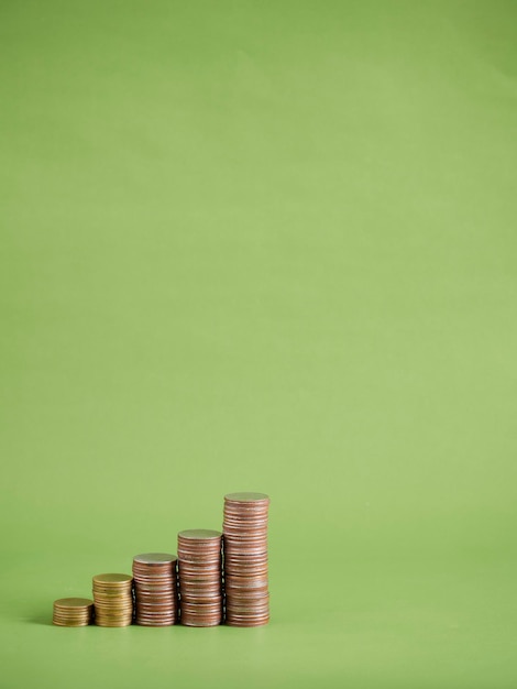 Coin stacks on green background