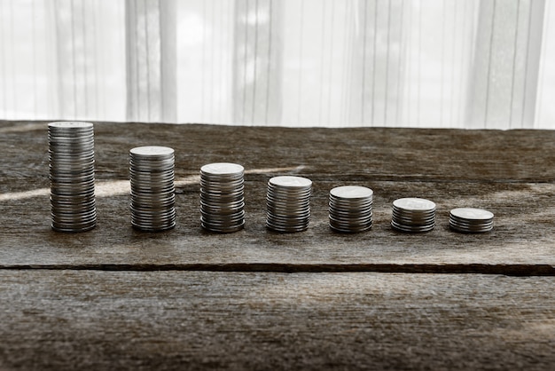 Coin stacks on wooden desk