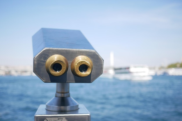 Coinoperated binoculars looking out over city