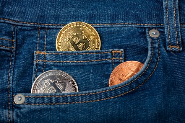 Coins bitcoin in denim pocket