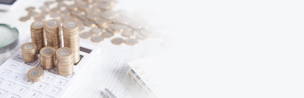 Coins and calculator on the business desk