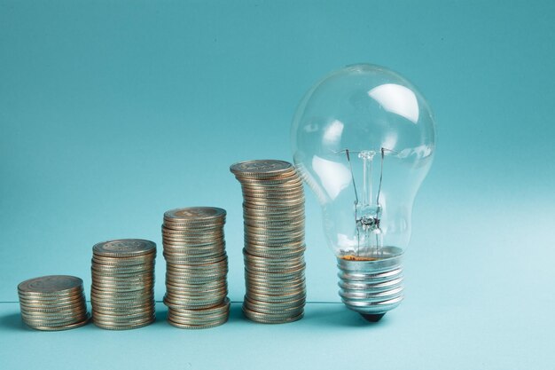 Coins in the form of a growing graph and a light bulb