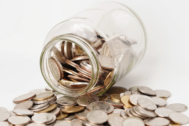 Coins in glass bottle