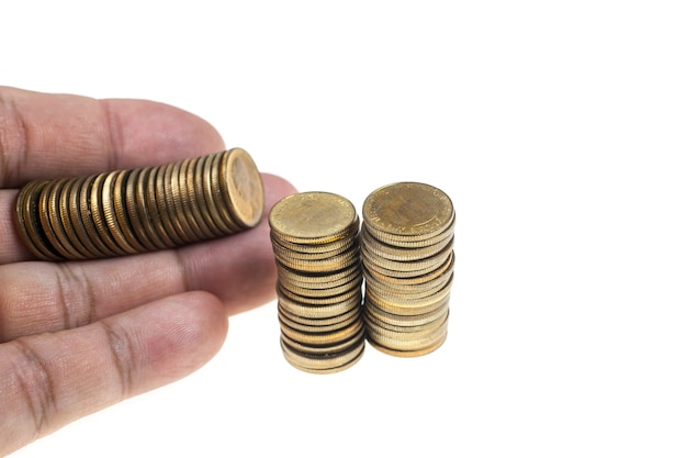 Coins in hand on white background