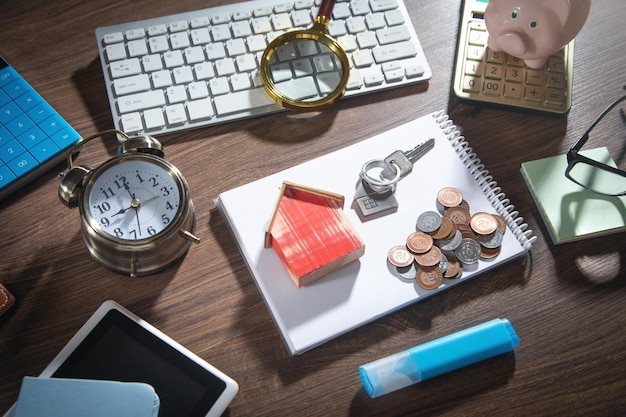 Photo coins house model and keys with a business objects