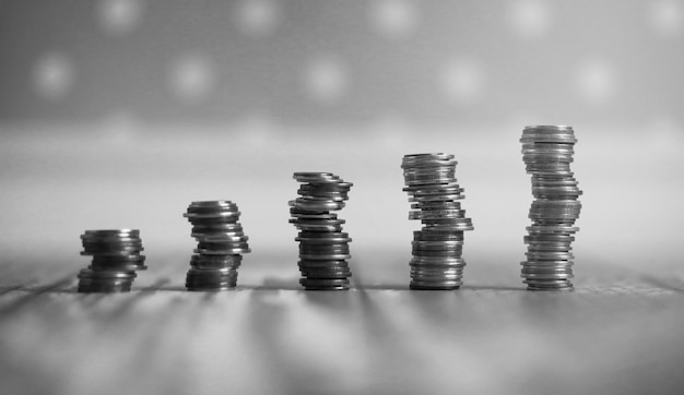 Photo coins in a jar on the floor. accumulated coins on the floor. pocket savings in piles.