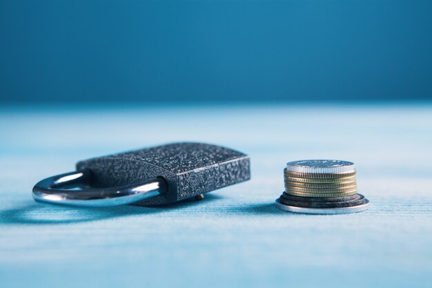 Coins and lock on the table