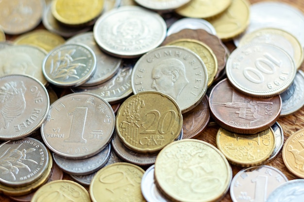 Coins old rusty brass pile, pack, heap, stack on a wooden background close up