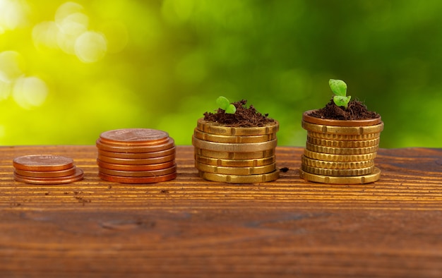 Coins stack of money and growing plant financial concept