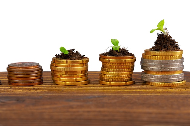 Coins stack of money and growing plant financial concept