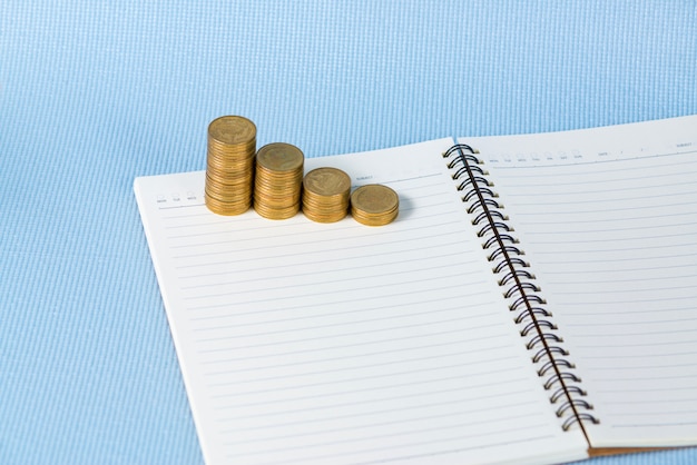 coins stack on notebook paper