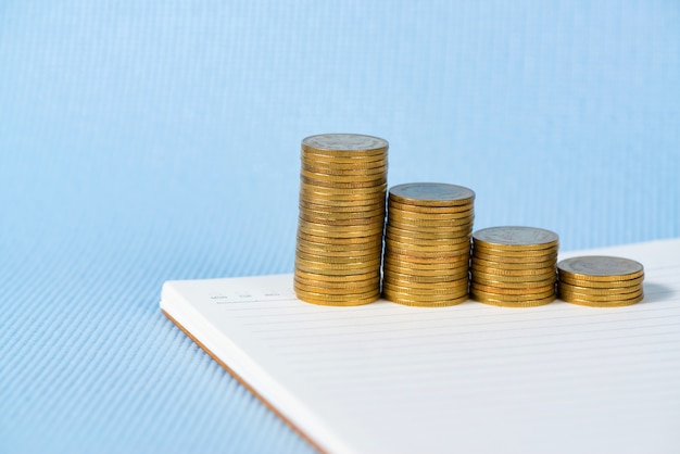 coins stack on notebook paper