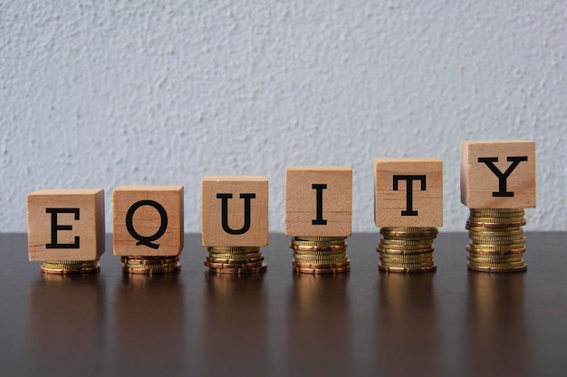 Coins Stack with Equity text on wooden blocks Business Concept