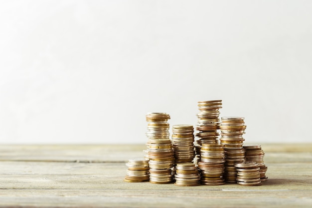 Coins stack on wooden table