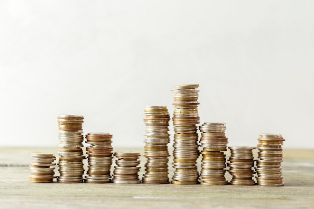 Coins stack on wooden table