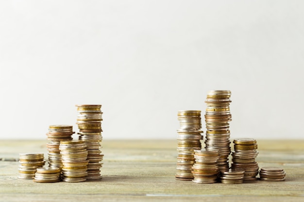 Coins stack on wooden table