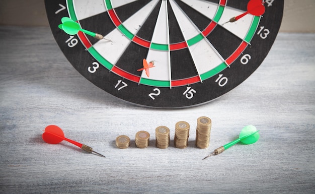 Coins and target dartboard. Business strategy.