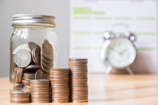 Photo coins with jar on table