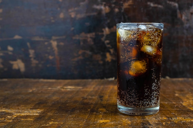Cola drink, black soft drinks in a glass on the table
